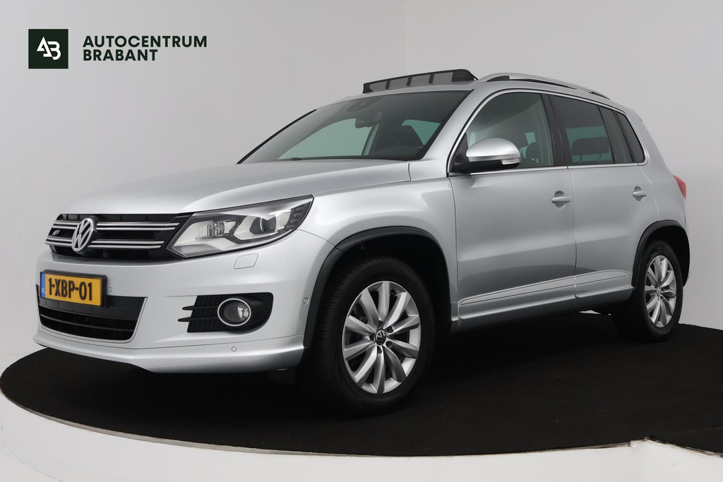 Volkswagen Tiguan 1.4 TSI R-Line Edition (TREKHAAK ELEKT. WEGKLAPBAAR, PANORAMADAK, CLIMA, NAVIGATIE, PARKEERSENSOREN) 47859772-0.jpg | Autocentrum Brabant Breda