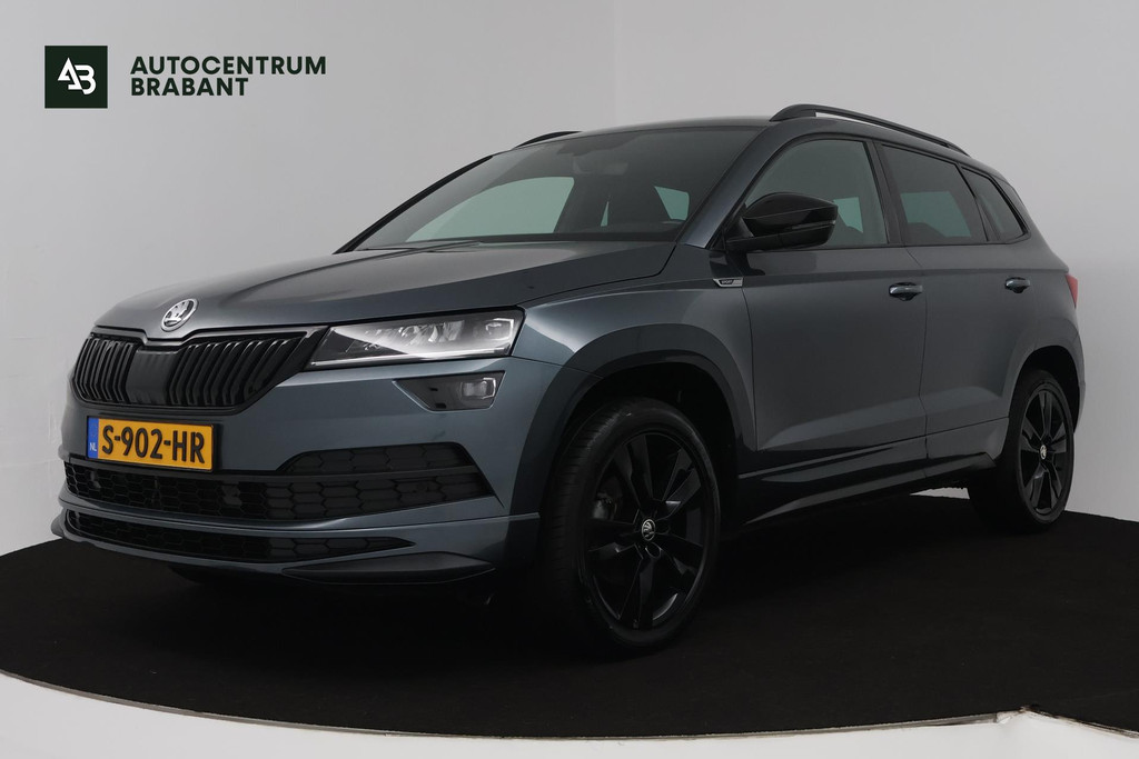 Škoda Karoq 1.5 TSI ACT Sportline Business (DIGITALE COCKPIT, STOEL/STUUR VERWARMING, TREKHAAK, SFEERVERLICHTING, CAMERA) 48037060-0.jpg | Autocentrum Brabant Breda