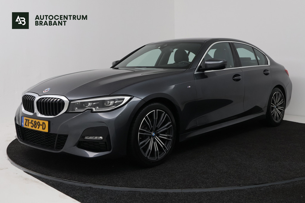 BMW 3 Serie 320i High Executive Edition (STOELVERWARMING, CAMERA, PDC, SFEERVERLICHTING, TREKHAAK AFNEEMBAAR, DEALER ONDERHOUDEN) 55806233-0.jpg | Autocentrum Brabant Breda